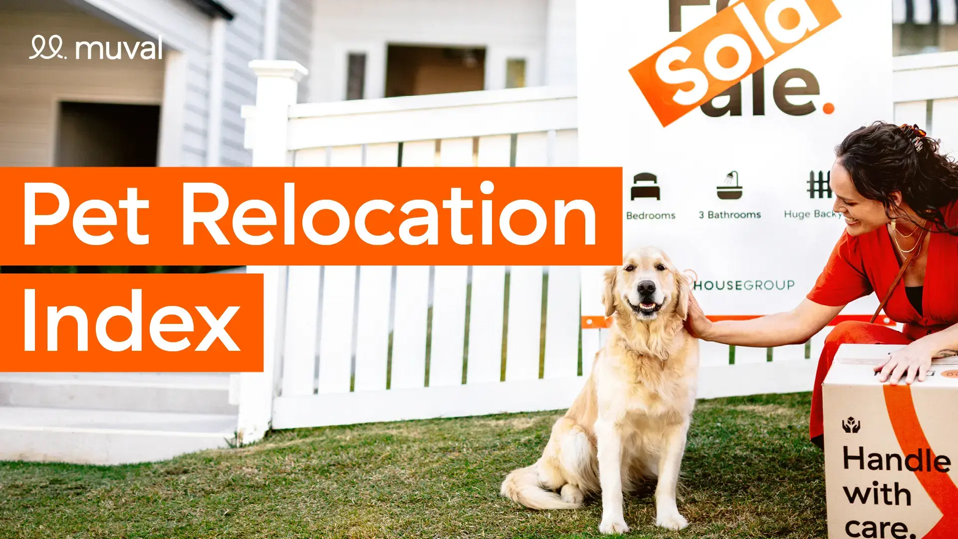 Woman patting a golden retriever dog in front of a house's sold sign