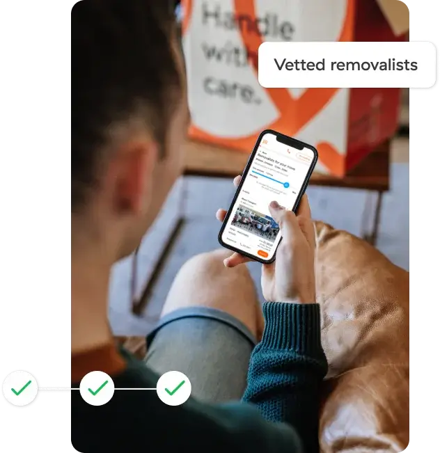 Person booking vetted removalists on mobile phone