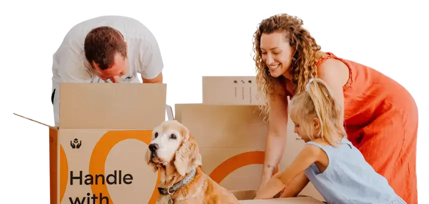 Family packing boxes with their dog