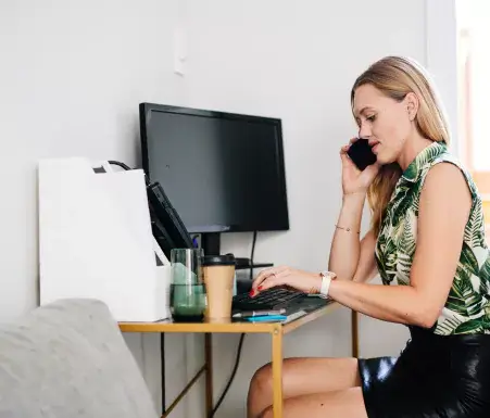 Woman sitting at home office desk