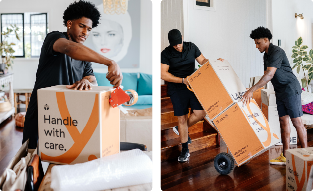 Two removalists moving boxes up stairs